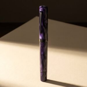 Entry Standard, Registry Violet — A deep violet swirled cast acrylic fountain pen with a blackened steel clip and cap band.